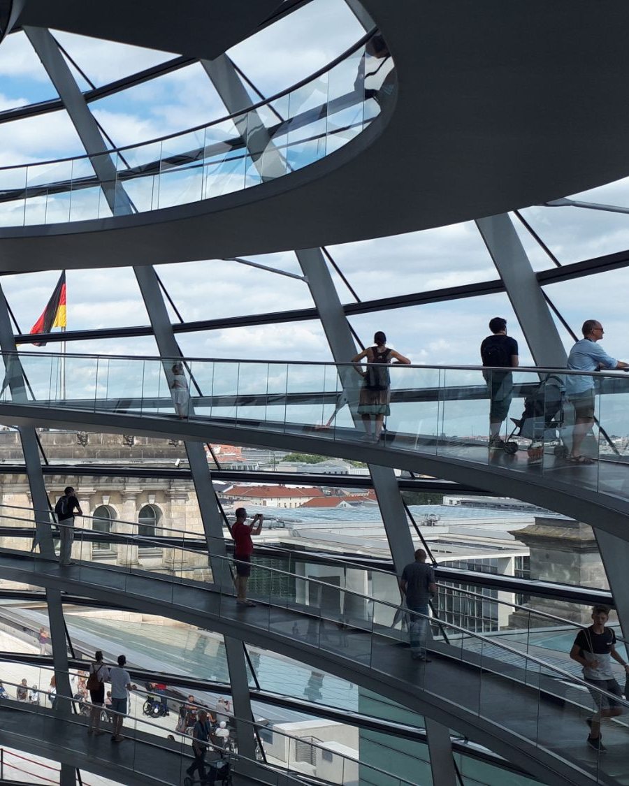 Visitors on the spiral ramps inside the glass Reichstag dome in Berlin